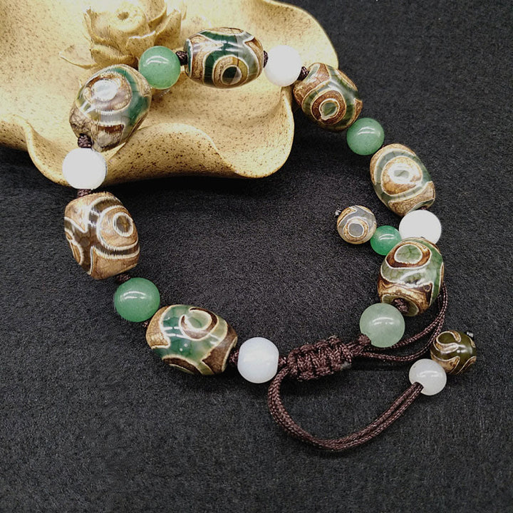 Bracelet tressé Buddha Stones à trois yeux avec perles Dzi et protection de la chance