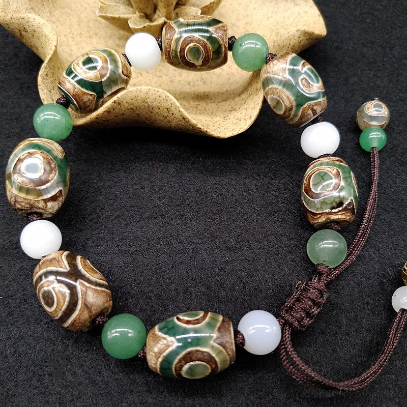 Bracelet tressé Buddha Stones à trois yeux avec perles Dzi et protection de la chance