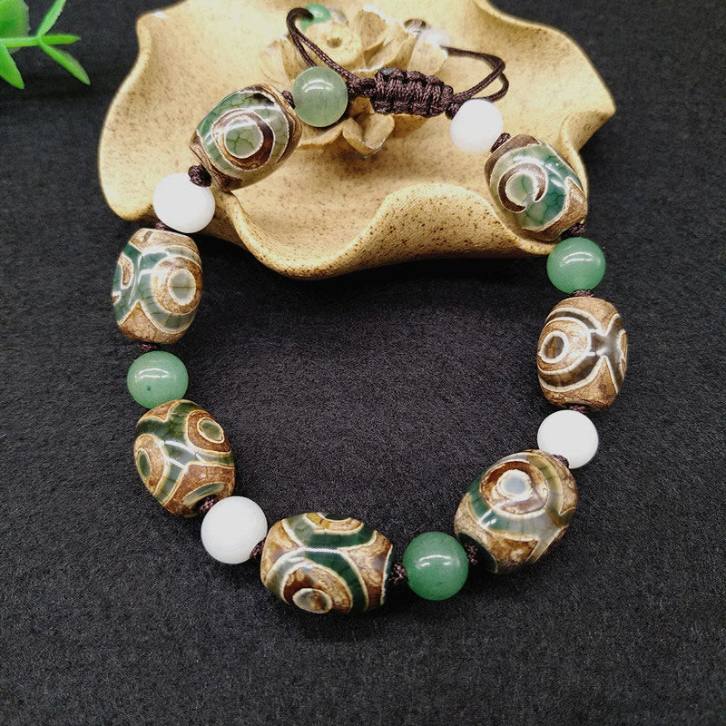 Bracelet tressé Buddha Stones à trois yeux avec perles Dzi et protection de la chance