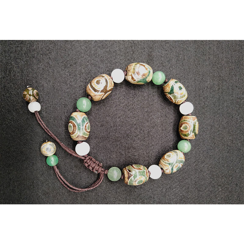 Bracelet tressé Buddha Stones à trois yeux avec perles Dzi et protection de la chance