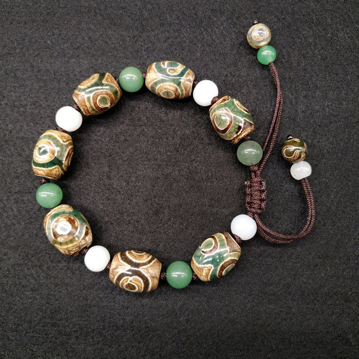 Bracelet tressé Buddha Stones à trois yeux avec perles Dzi et protection de la chance