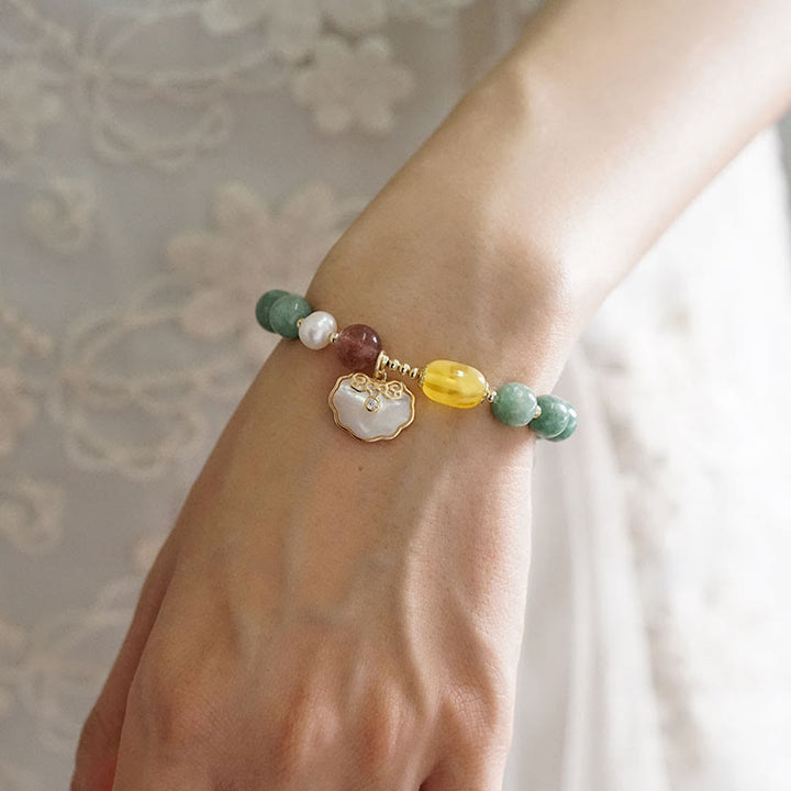 Bracelet porte-bonheur en jade et coquillages de Buddha Stones Ruyi
