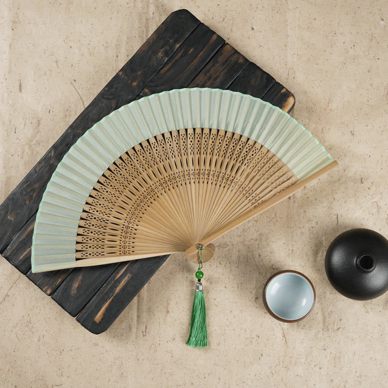 Éventail pliable en bambou à main avec gravure simple et creuse en forme de fleur de cerisier avec Buddha Stones - Vert 22 cm - image 0