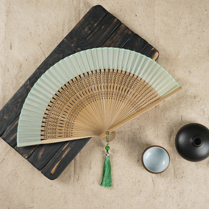 Éventail pliable en bambou à main avec gravure simple et creuse en forme de fleur de cerisier avec Buddha Stones - Vert 22 cm - image 0
