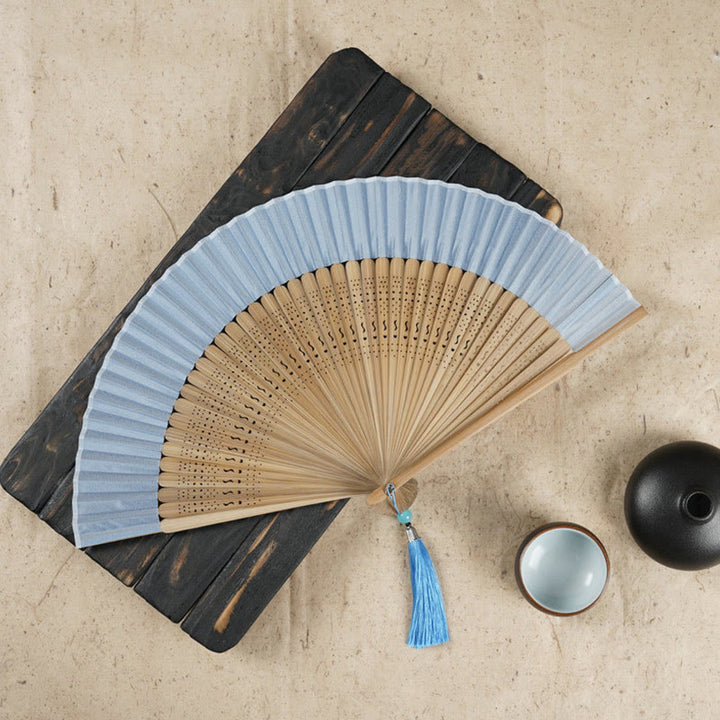 Éventail pliable en bambou à main avec gravure simple et creuse en forme de fleur de cerisier avec Buddha Stones - Bleu 22 cm - image 6