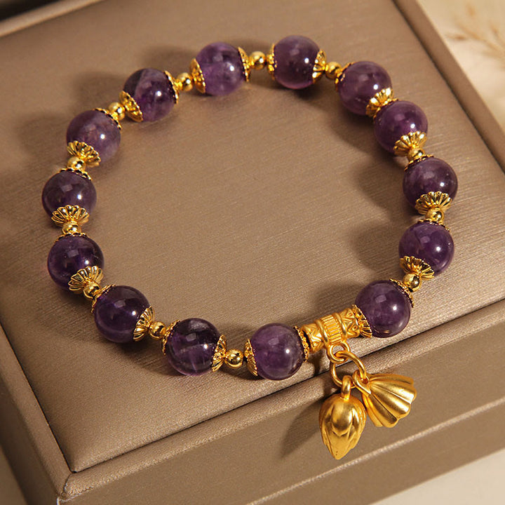Bracelet spirituel de guérison en améthyste naturelle et lotus en Buddha Stones
