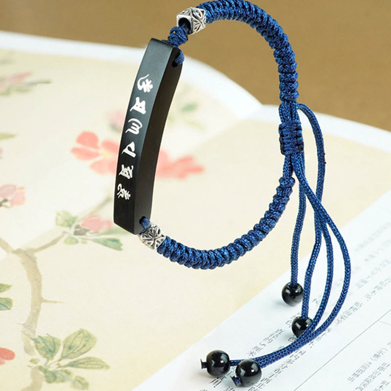Bracelet de protection incrusté d'argent en bois d'ébène et de Buddha Stones