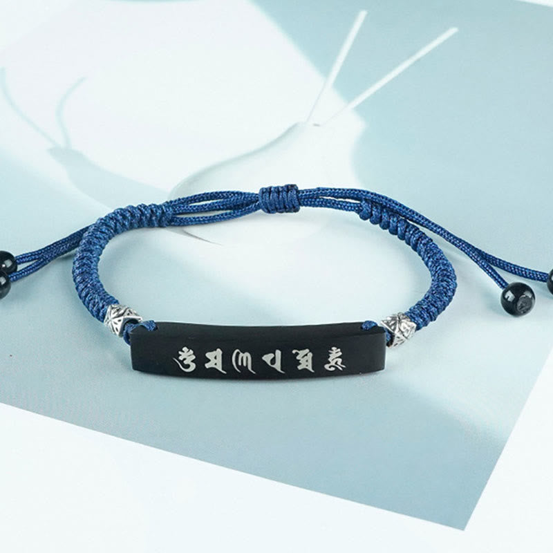 Bracelet de protection incrusté d'argent en bois d'ébène et de Buddha Stones