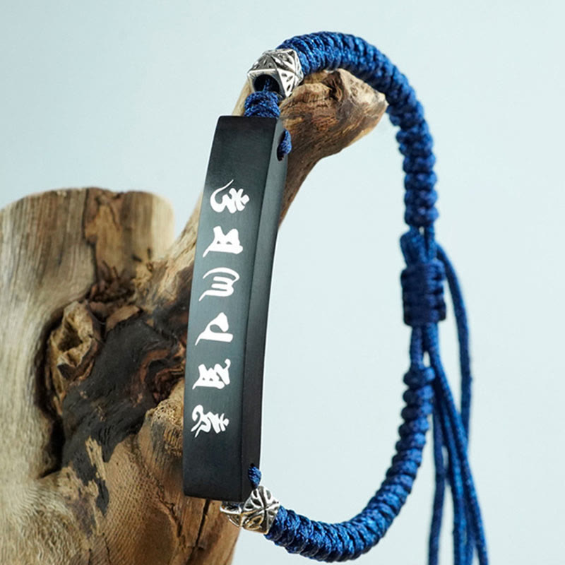 Bracelet de protection incrusté d'argent en bois d'ébène et de Buddha Stones
