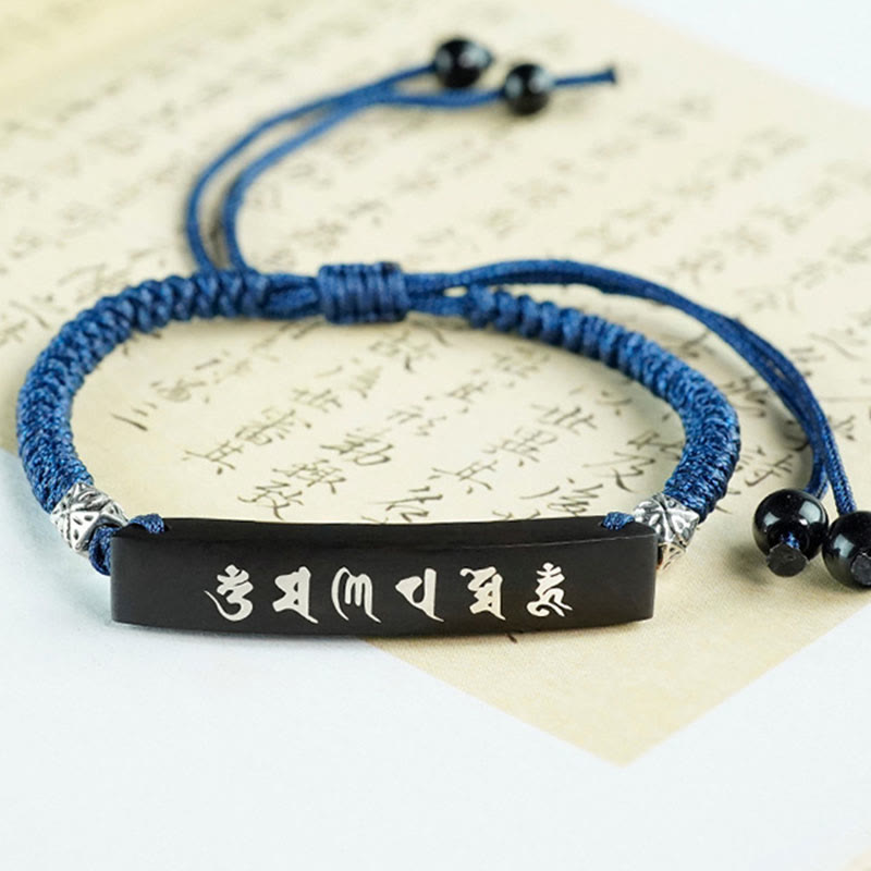 Bracelet de protection incrusté d'argent en bois d'ébène et de Buddha Stones