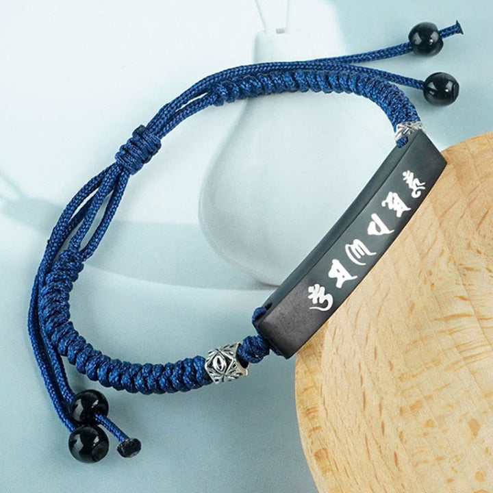 Bracelet de protection incrusté d'argent en bois d'ébène et de Buddha Stones