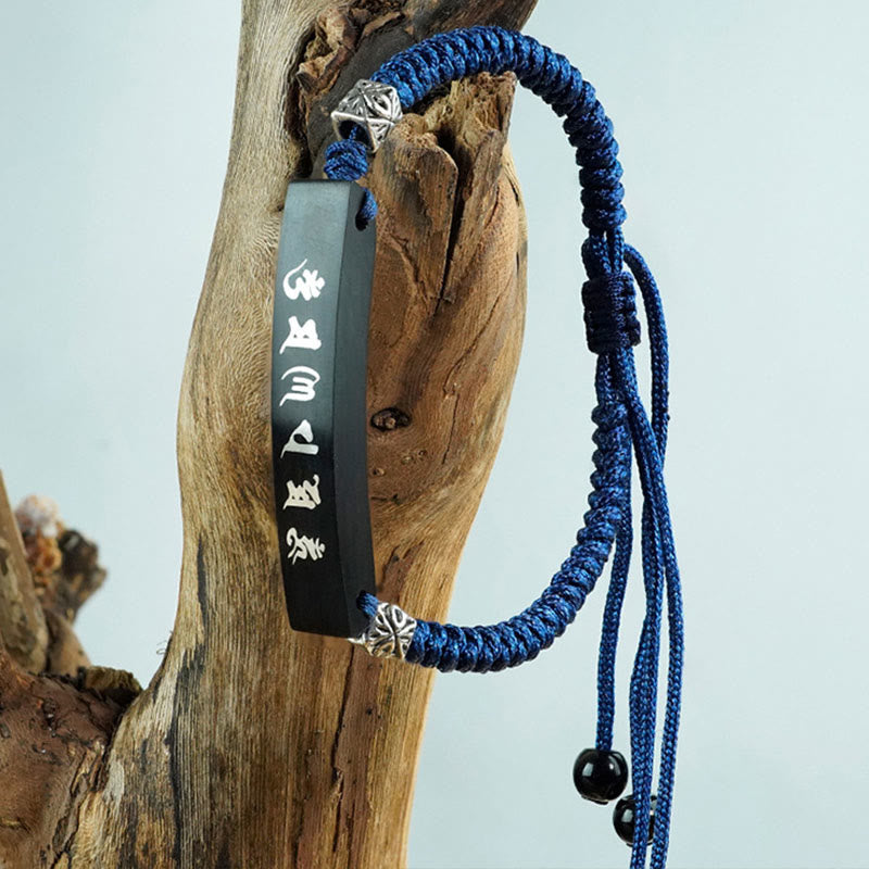 Bracelet de protection incrusté d'argent en bois d'ébène et de Buddha Stones