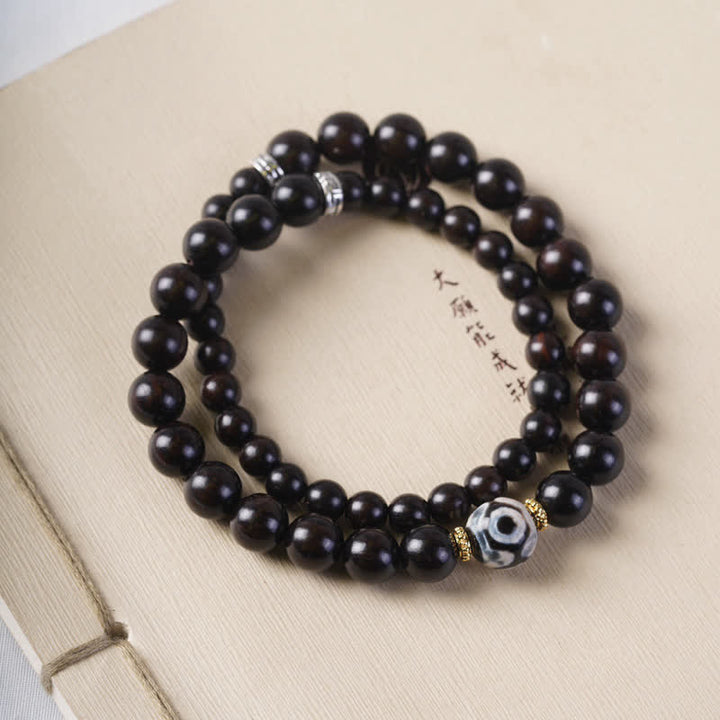 Bracelet double tour en perles dzi en bois d'ébène tibétain et Buddha Stones