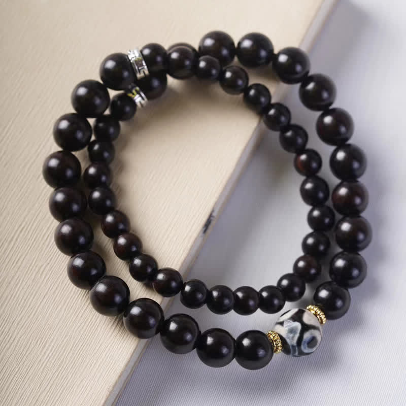 Bracelet double tour en perles dzi en bois d'ébène tibétain et Buddha Stones