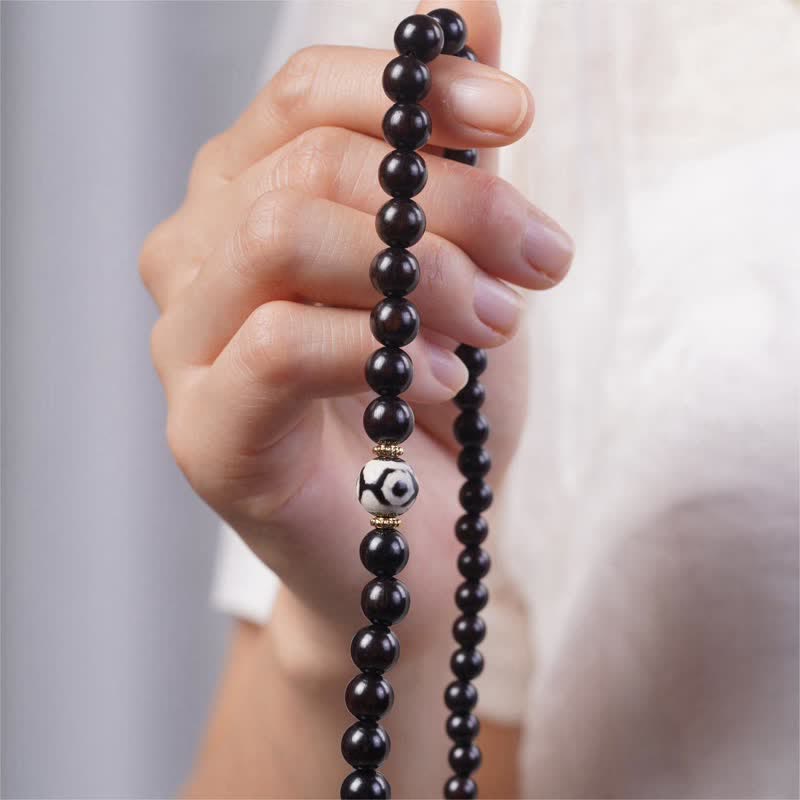 Bracelet double tour en perles dzi en bois d'ébène tibétain et Buddha Stones