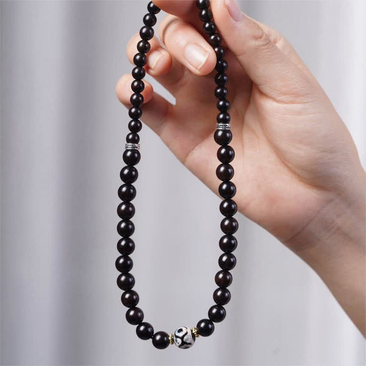Bracelet double tour en perles dzi en bois d'ébène tibétain et Buddha Stones