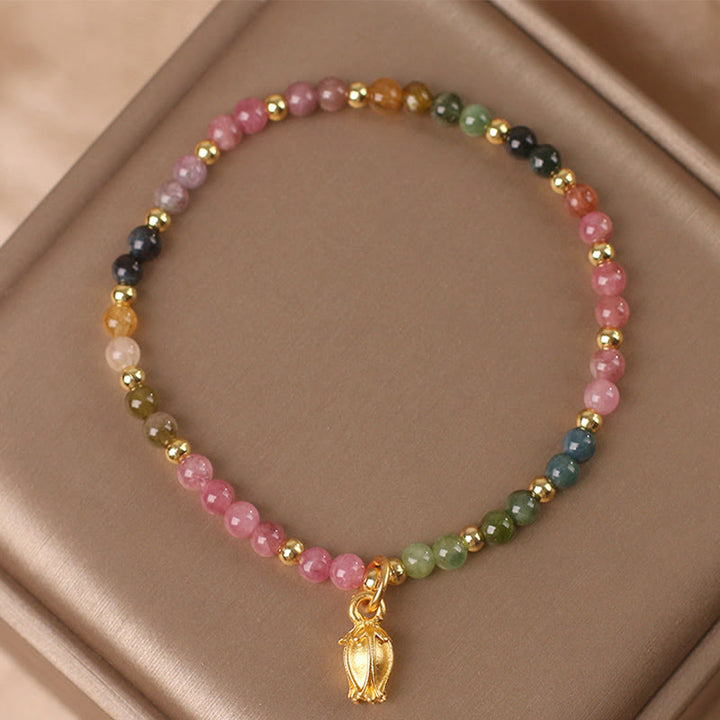 Bracelet positif en Buddha Stones et fleurs de tourmaline colorées