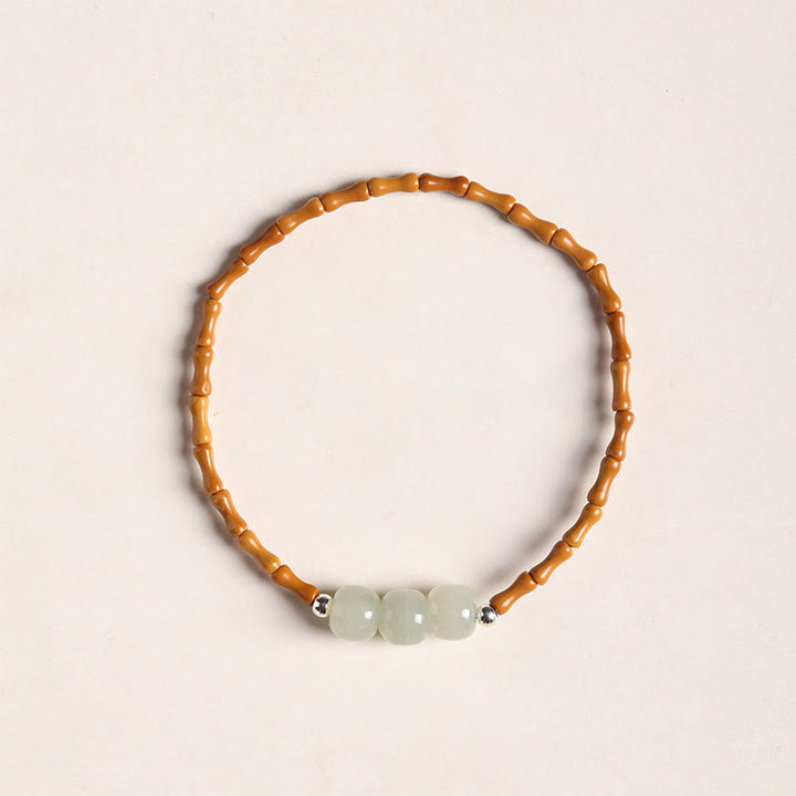 Bracelet porte-bonheur en perles de jade Hetian à motif de bambou et noyau d'olive naturelle de Buddha Stones