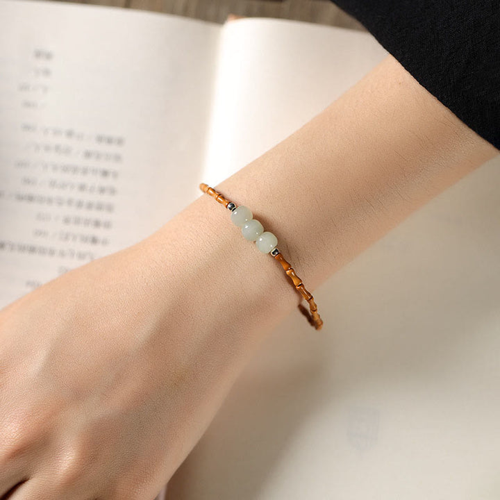 Bracelet porte-bonheur en perles de jade Hetian à motif de bambou et noyau d'olive naturelle de Buddha Stones