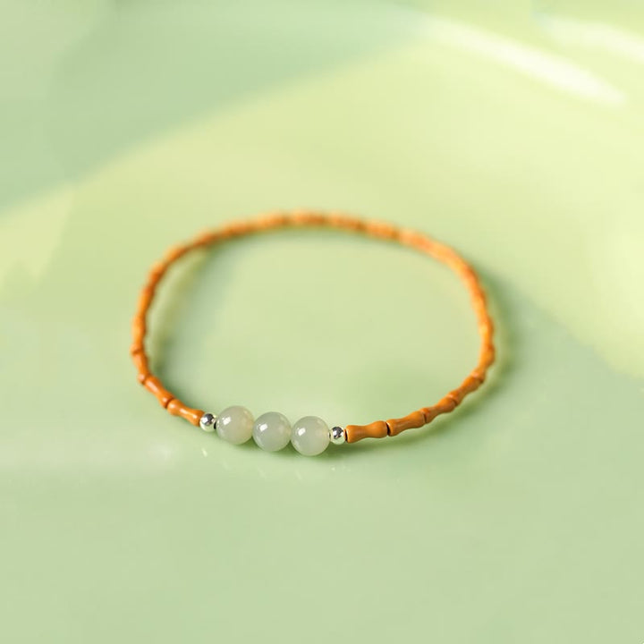 Bracelet porte-bonheur en perles de jade Hetian à motif de bambou et noyau d'olive naturelle de Buddha Stones