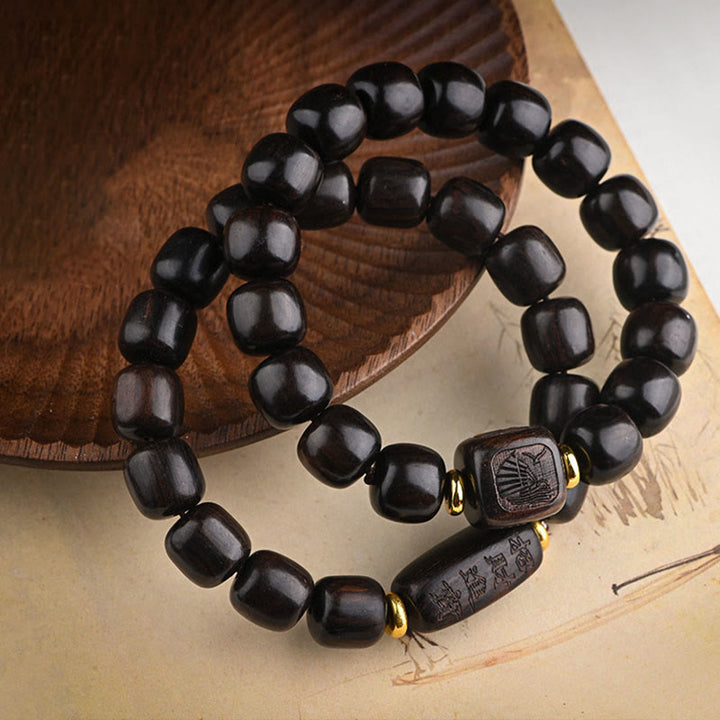 Bracelet d'équilibre porte-bonheur et trésor en perles de bois d'ébène tibétain avec Buddha Stones