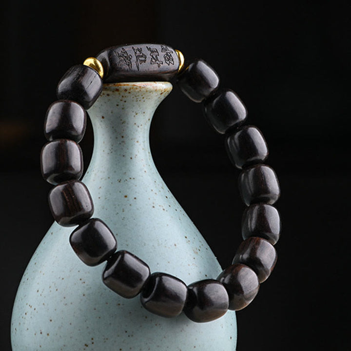 Bracelet d'équilibre porte-bonheur et trésor en perles de bois d'ébène tibétain avec Buddha Stones
