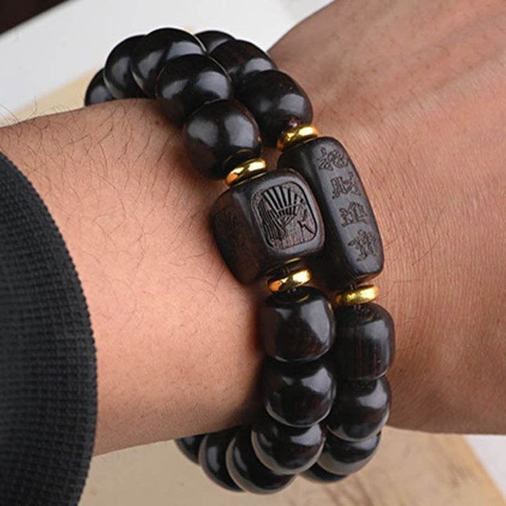 Bracelet d'équilibre porte-bonheur et trésor en perles de bois d'ébène tibétain avec Buddha Stones