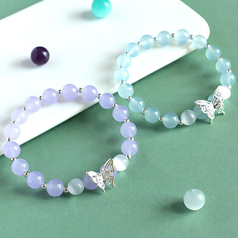 Bracelet énergétique papillon en Buddha Stones, calcédoine bleue, cristal rose, calcédoine violette - image 1