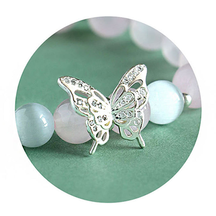 Bracelet énergétique papillon en Buddha Stones, calcédoine bleue, cristal rose, calcédoine violette