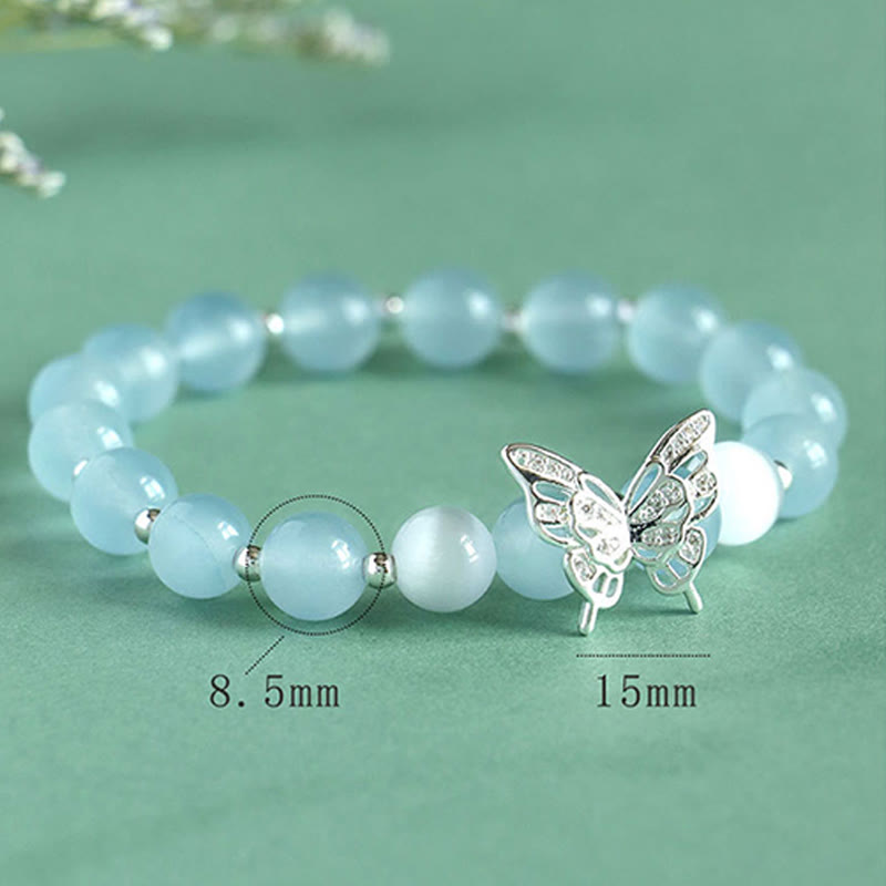 Bracelet énergétique papillon en Buddha Stones, calcédoine bleue, cristal rose, calcédoine violette