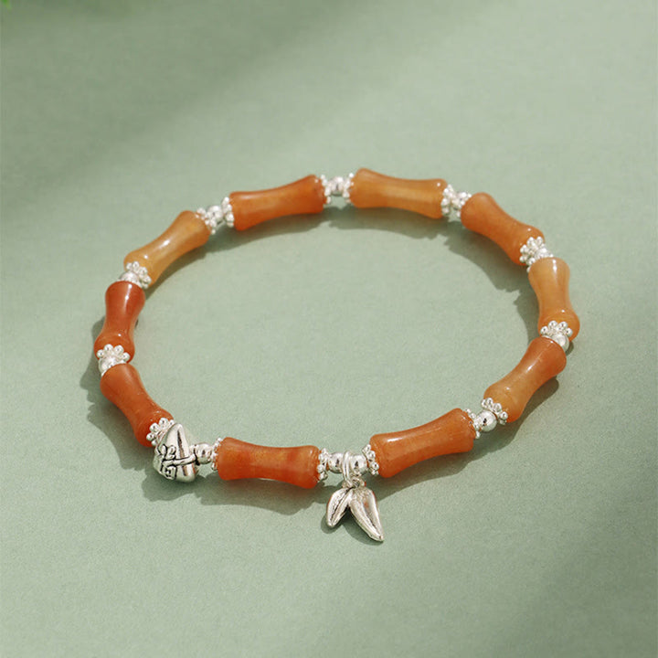 Bracelet porte-bonheur en Buddha Stones, péridot, jade blanc, quartz fraise, aventurine verte, bambou, personnage Fu