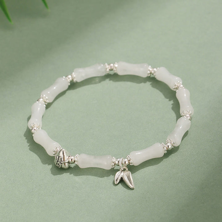 Bracelet porte-bonheur en Buddha Stones, péridot, jade blanc, quartz fraise, aventurine verte, bambou, personnage Fu