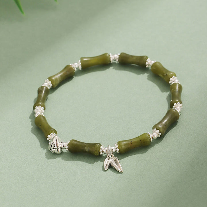 Bracelet porte-bonheur en Buddha Stones, péridot, jade blanc, quartz fraise, aventurine verte, bambou, personnage Fu