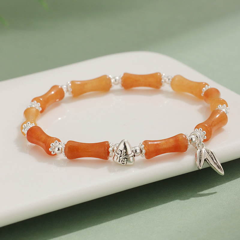 Bracelet porte-bonheur en Buddha Stones, péridot, jade blanc, quartz fraise, aventurine verte, bambou, personnage Fu