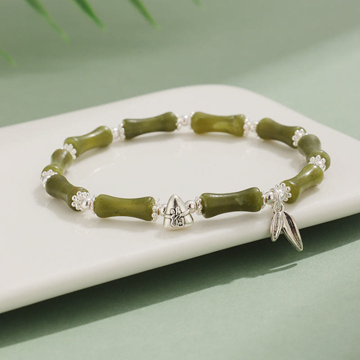 Bracelet porte-bonheur en Buddha Stones, péridot, jade blanc, quartz fraise, aventurine verte, bambou, personnage Fu
