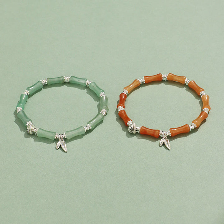 Bracelet porte-bonheur en Buddha Stones, péridot, jade blanc, quartz fraise, aventurine verte, bambou, personnage Fu