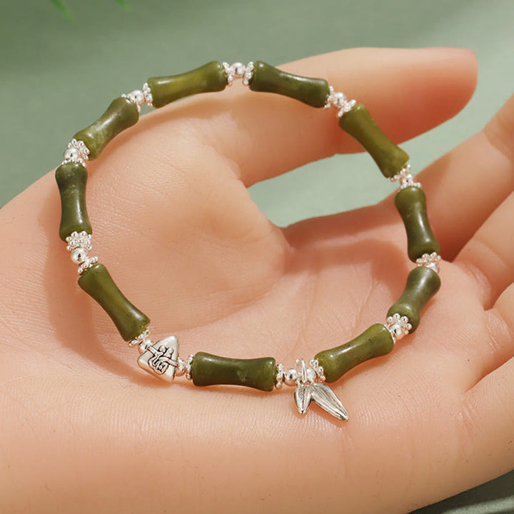 Bracelet porte-bonheur en Buddha Stones, péridot, jade blanc, quartz fraise, aventurine verte, bambou, personnage Fu