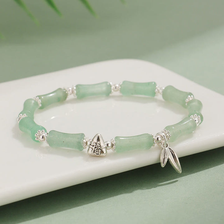 Bracelet porte-bonheur en Buddha Stones, péridot, jade blanc, quartz fraise, aventurine verte, bambou, personnage Fu