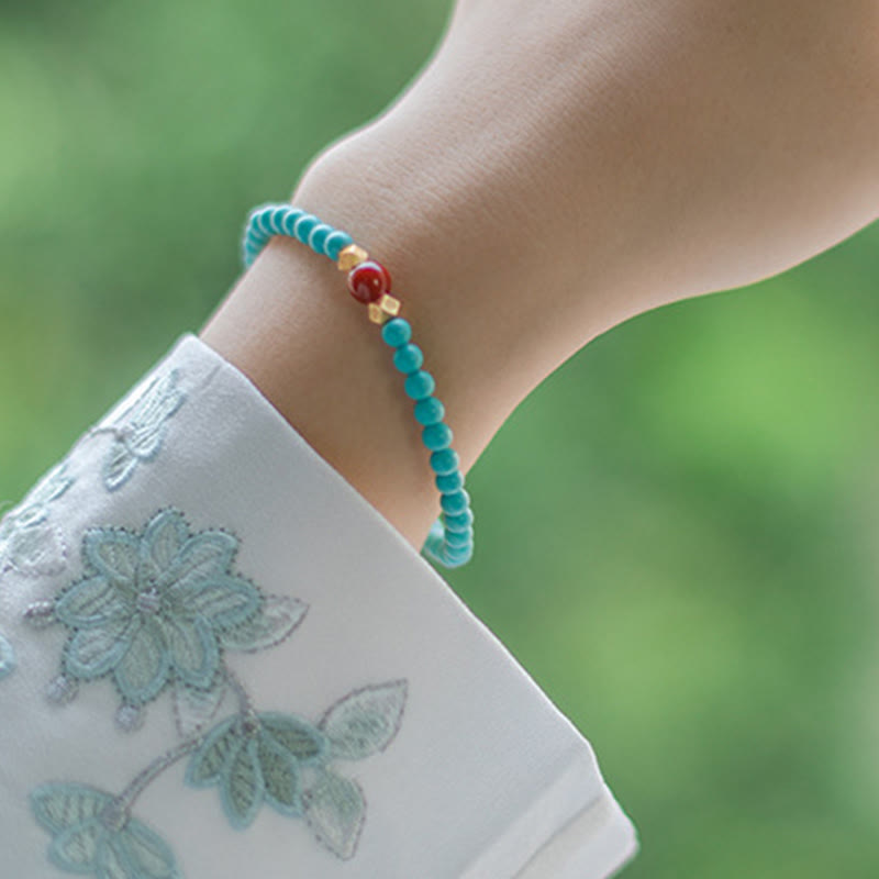 Bracelet de protection en perles d'agate rouge turquoise de Buddha Stones