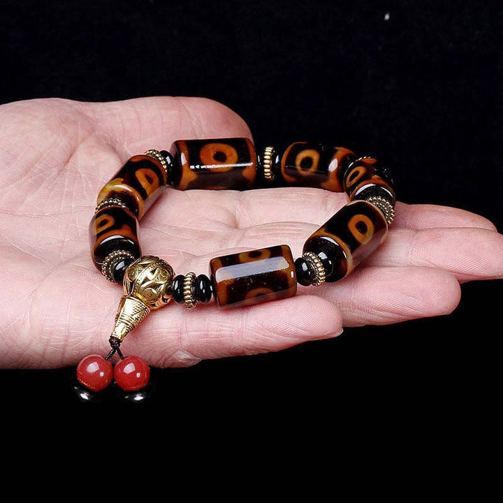 Bracelet porte-bonheur tibétain en perles dzi à neuf yeux Buddha Stones
