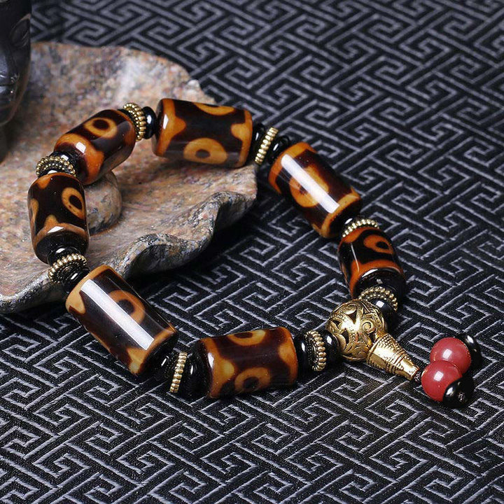 Bracelet porte-bonheur tibétain en perles dzi à neuf yeux Buddha Stones
