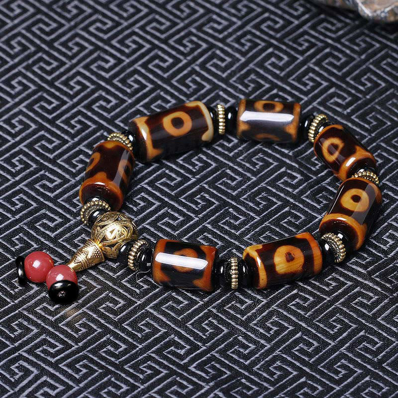 Bracelet porte-bonheur tibétain en perles dzi à neuf yeux Buddha Stones