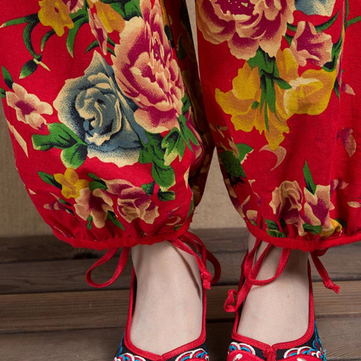 Pantalon sarouel à imprimé fleurs rouges et vertes de style ethnique avec Buddha Stones et poches