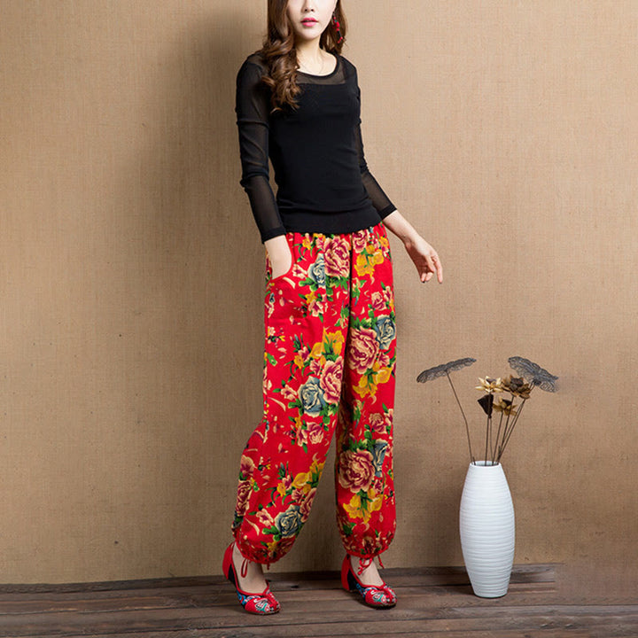 Pantalon sarouel à imprimé fleurs rouges et vertes de style ethnique avec Buddha Stones et poches