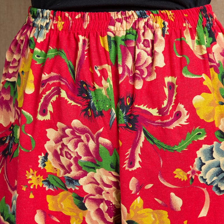 Pantalon sarouel à imprimé fleurs rouges et vertes de style ethnique avec Buddha Stones et poches