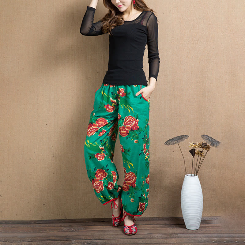 Pantalon sarouel à imprimé fleurs rouges et vertes de style ethnique avec Buddha Stones et poches