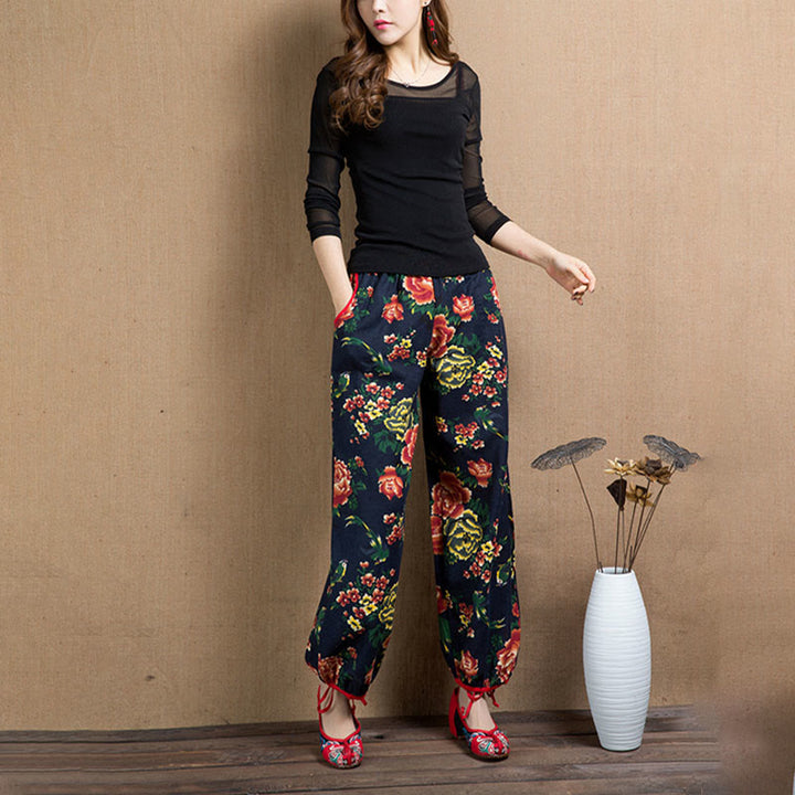 Pantalon sarouel à imprimé fleurs rouges et vertes de style ethnique avec Buddha Stones et poches