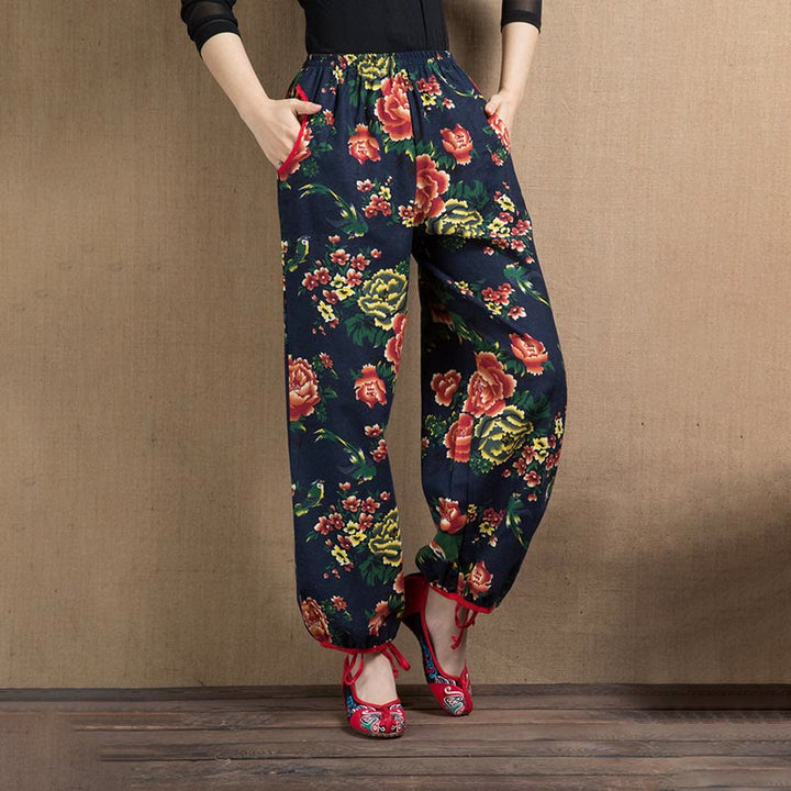 Pantalon sarouel à imprimé fleurs rouges et vertes de style ethnique avec Buddha Stones et poches