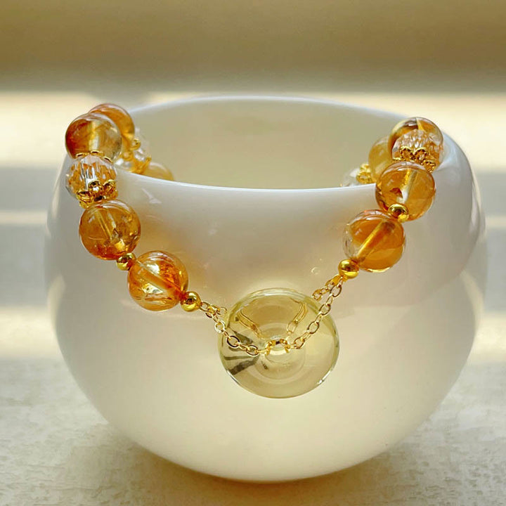 Bracelet de prospérité en cristal de citrine avec boucle de paix et Buddha Stones