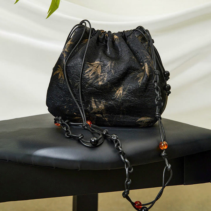 Sac à bandoulière en acétate à motif de feuilles de bambou jaune Buddha Stones